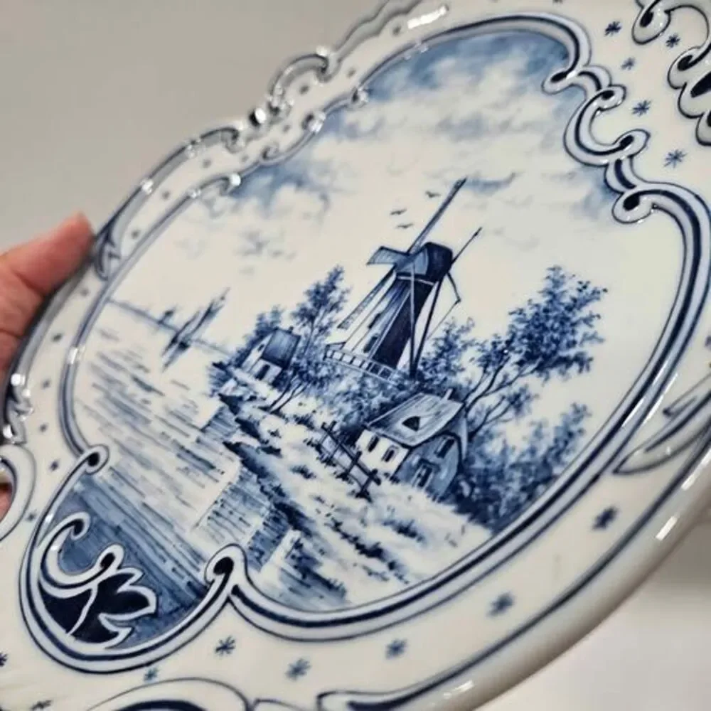 Blue and white windmill decorative plate